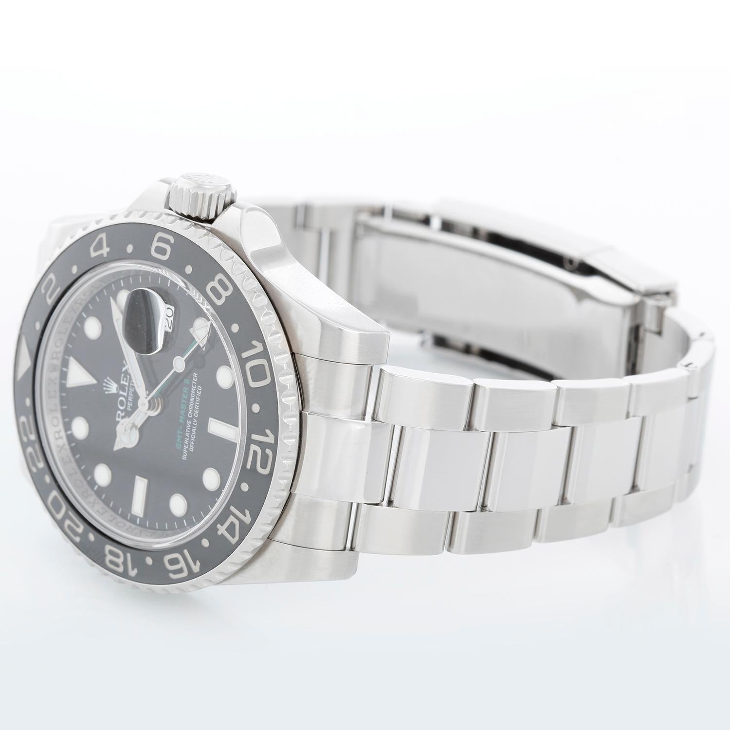 Men's Rolex GMT-Master II Watch Ceramic Bezel 116710 (116710N) - Automatic winding, 31 jewels. Stainless steel case with 24 hour ceramic bezel, engraved inside  (40mm diameter). Black dial with luminous markers; green GMT hand. Stainless steel