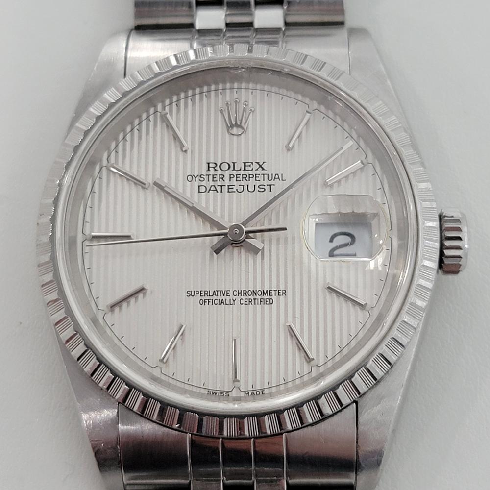 A rare, iconic classic, Men's all-stainless steel Rolex Oyster Datejust ref.16220 automatic, c.1991, all original. Verified authentic by a master watchmaker. Gorgeous, rare Rolex signed tapestry dial, applied silver indice hour markers, silver