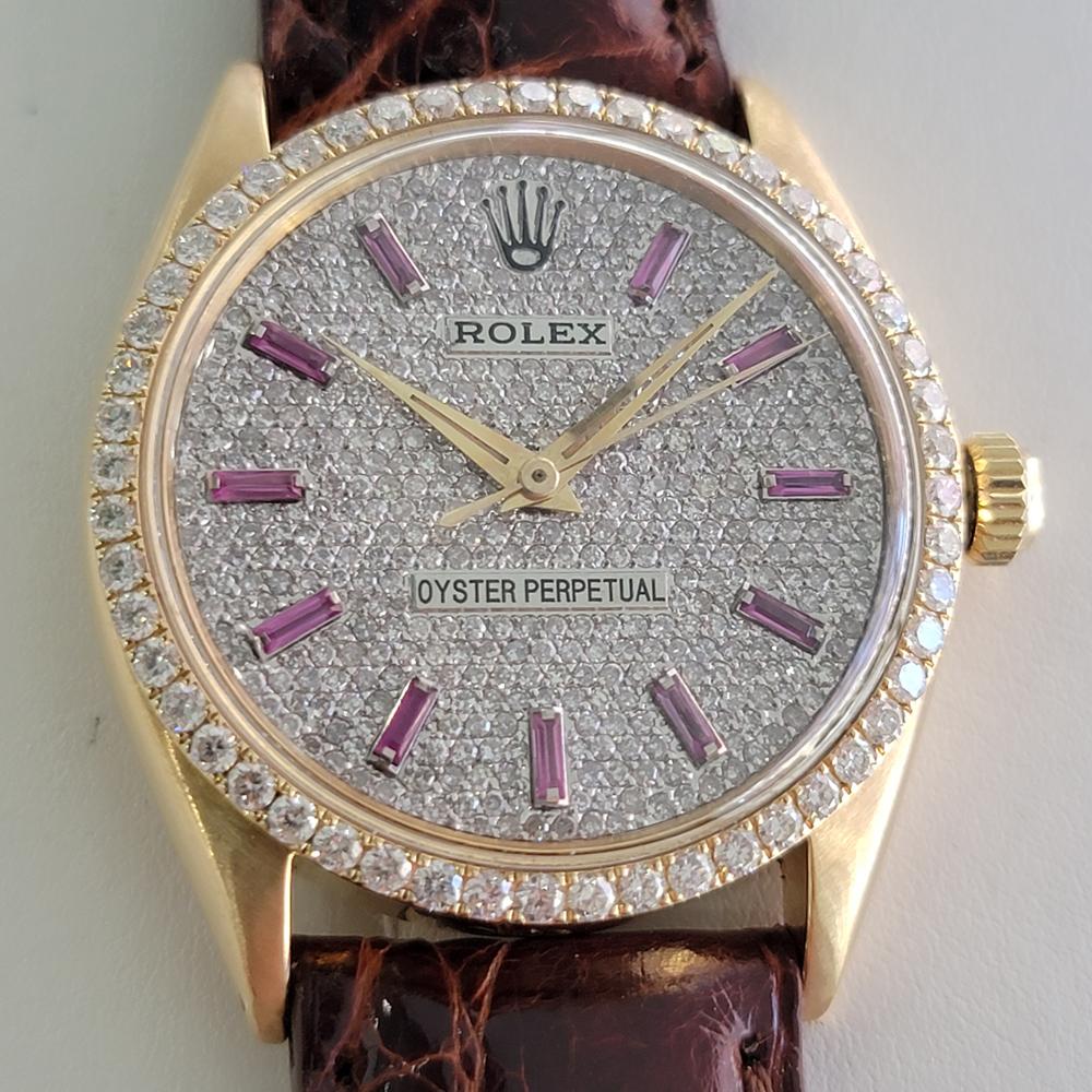 A bold and spectacular iconic classic, Men's 18K solid gold Rolex Oyster Perpetual 1005 automatic with brilliant aftermarket gemmed dial and diamond bezel, c.1960s. Verified authentic by a master watchmaker. Gorgeous, gemmed Rolex dial, applied pink