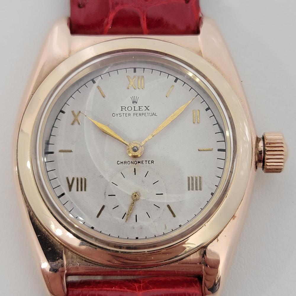 A rare timeless classic, Men's solid 14k rose and yellow gold Rolex ref.3131 Oyster Perpetual bubbleback automatic dress watch, c.1946. Verified authentic by a master watchmaker. Gorgeous Rolex signed dial, indice and Roman numeral hour markers,