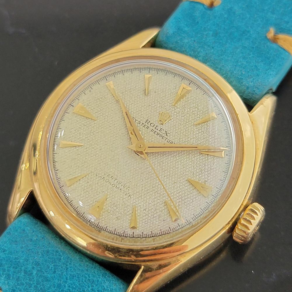 Luxurious classic, Men's 18k solid gold Rolex Oyster perpetual automatic dress watch, c.1952. Verified authentic by a master watchmaker. Gorgeous Rolex signed tapisserie dial, applied index hour markers, gilt minute and hour hands, sweeping central