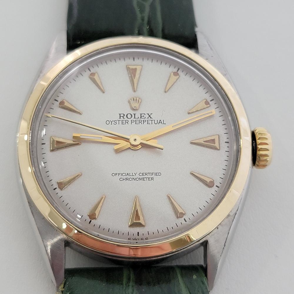 Classic icon, Men's 14k gold & ss Rolex Oyster Perpetual automatic dress watch, c.1952. Verified authentic by a master watchmaker. Gorgeous Rolex signed dial, applied gold dagger hour markers, gilt minute and hour hands, sweeping central second