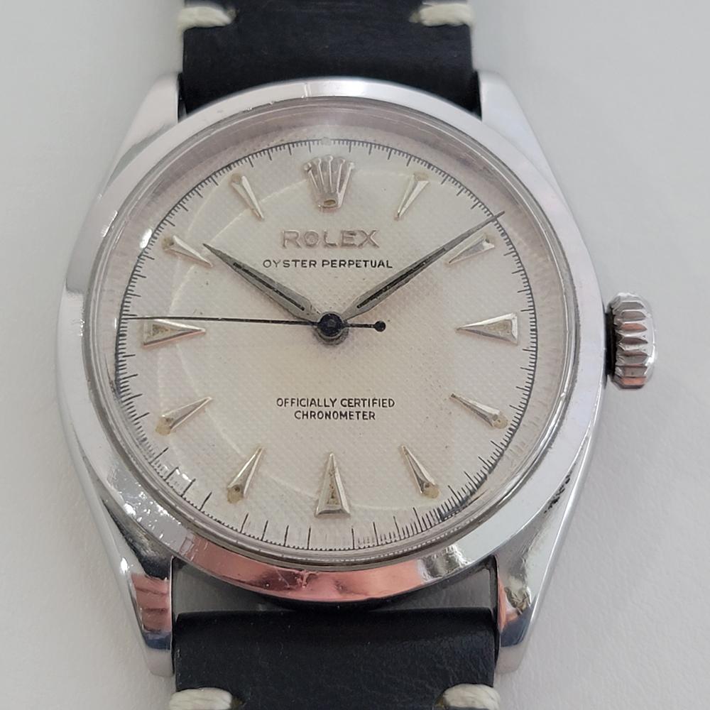 A rare vintage classic, Men's Rolex Oyster Perpetual Ref.6284 bubble back automatic dress watch, c.1955. Verified authentic by a master watchmaker. Gorgeous Rolex signed white textured dial, applied indice hour markers, minute and hour hands,
