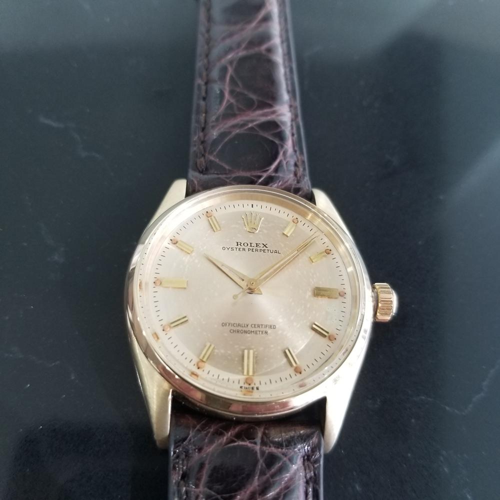 A rare timeless classic, Men's 14k solid gold Rolex ref.6564 Oyster Perpetual automatic dress watch, c.1957. Verified authentic by a master watchmaker. Gorgeous Rolex signed gold dial, applied indice hour markers, gilt minute and hour hands,