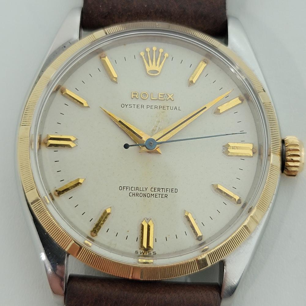Iconic classic, Men's 14k rose gold and stainless steel Rolex ref.6565 Oyster Perpetual automatic dress watch, c.1955. Verified authentic by a master watchmaker. Gorgeous Rolex signed dial, applied indice and arrowhead hour markers, gilt minute and
