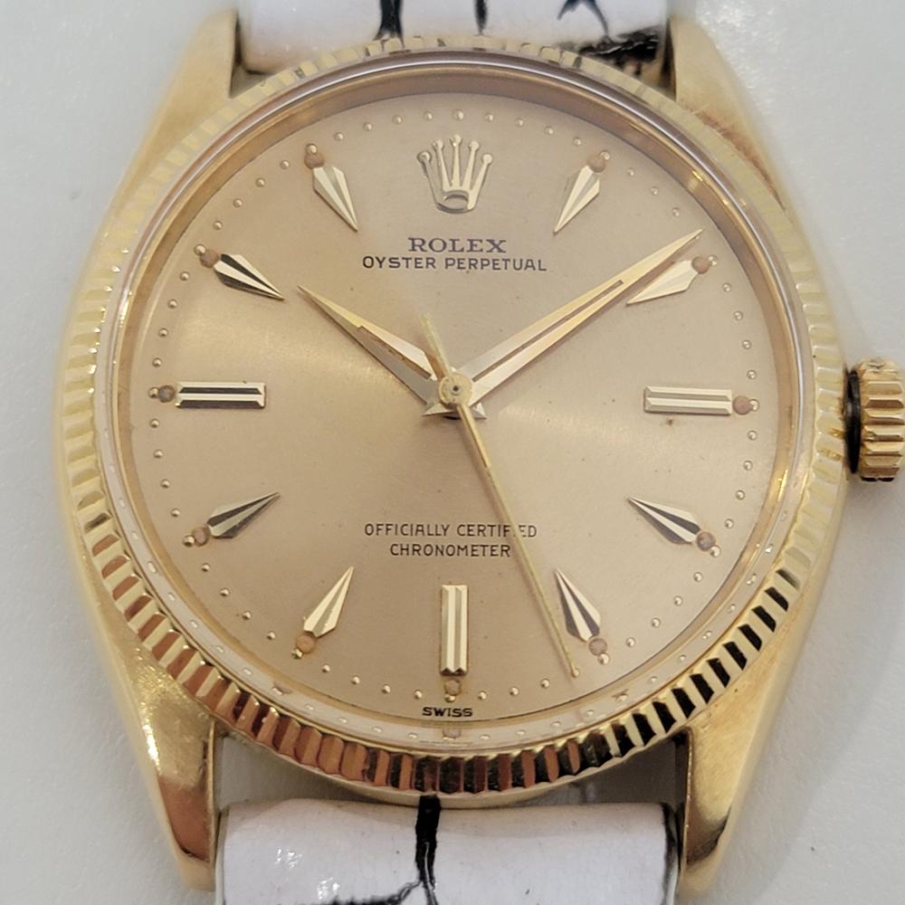 Timeless luxury, Men's 18k solid gold Rolex Oyster Perpetual Ref.6567 automatic dress watch, c.1956, in excellent working condition. Verified authentic by a master watchmaker. Gorgeous, gold Rolex signed dial, applied gold dagger indice hour