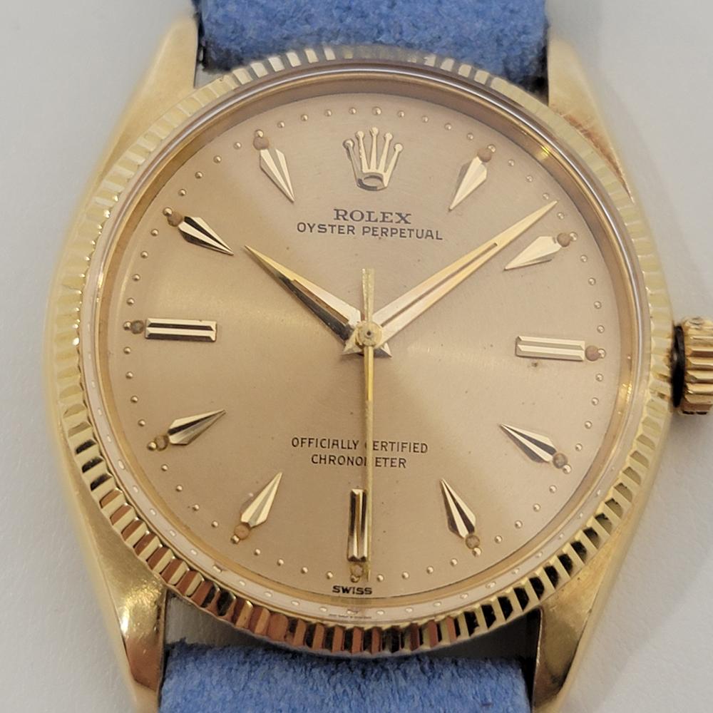 Luxurious icon, Men's 18k solid gold Rolex Oyster Perpetual Ref.6567 automatic dress watch, c.1956, in excellent working condition. Verified authentic by a master watchmaker. Gorgeous, gold Rolex signed dial, applied gold dagger hour markers, gilt
