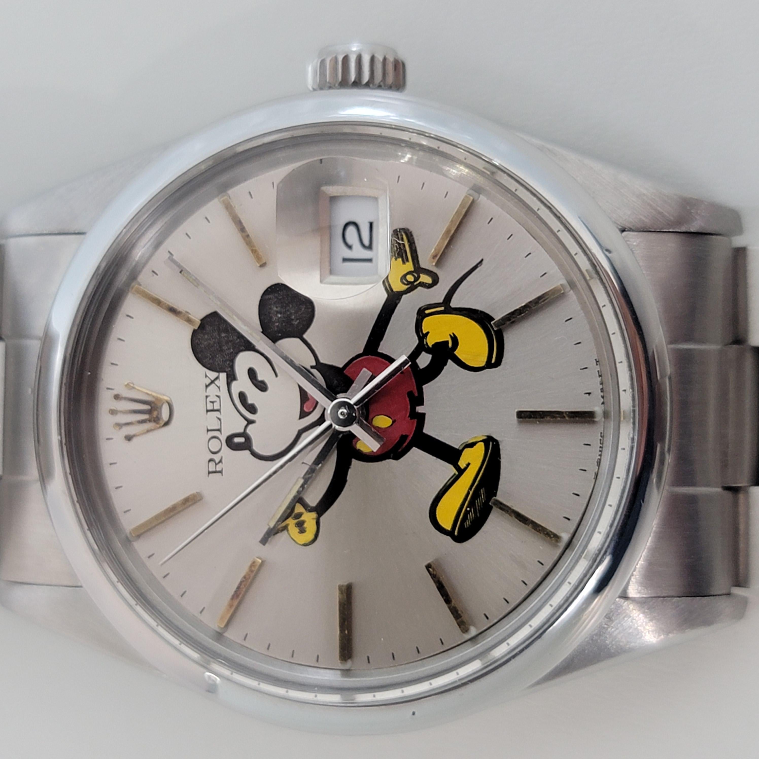 Timeless icon, Men's Rolex Oyster Perpetual Date 15000 automatic Mickey dial, c.1982. Verified authentic by a master watchmaker. Iconic Rolex signed silver Mickey dial, applied gilt indice hour markers, silver minute and hour hands, sweeping central