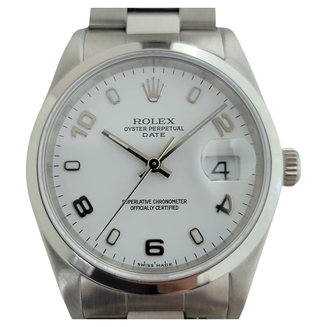Iconic classic, Men's Rolex Oyster Perpetual Date 15200 automatic, c.2002, all original, unworn condition, with Rolex pouch. Verified authentic by a master watchmaker. Stunning Rolex signed polar white dial, applied lumed indice and alternating