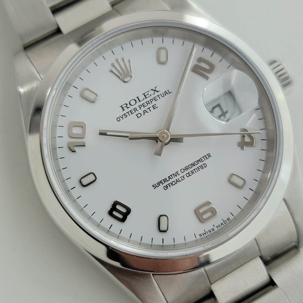 Iconic classic, Men's Rolex Oyster Perpetual Date 15200 automatic, c.2002, all original, unworn condition, with Rolex pouch. Verified authentic by a master watchmaker. Stunning Rolex signed polar white dial, applied lumed indice and alternating