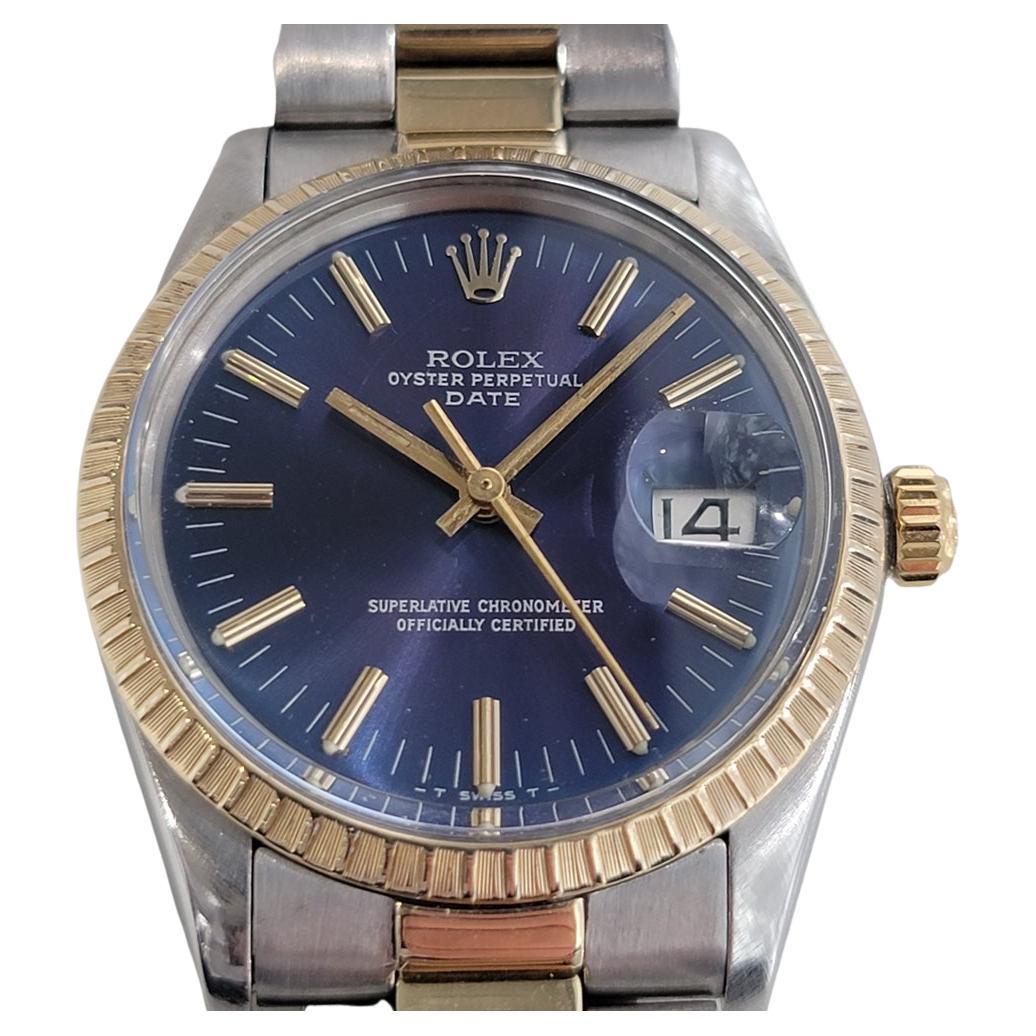 A stunning timeless classic, Men's Rolex Oyster Perpetual Date Ref 15053 automatic with 14k solid gold bezel, c.1981, all original. Verified authentic by a master watchmaker. Gorgeous Rolex signed blue dial, applied gold indice hour markers, gilt