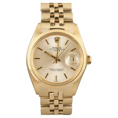 Rolex Oyster Perpetual Date Montre pour hommes en or jaune 14 carats massif avec cadran champagne
