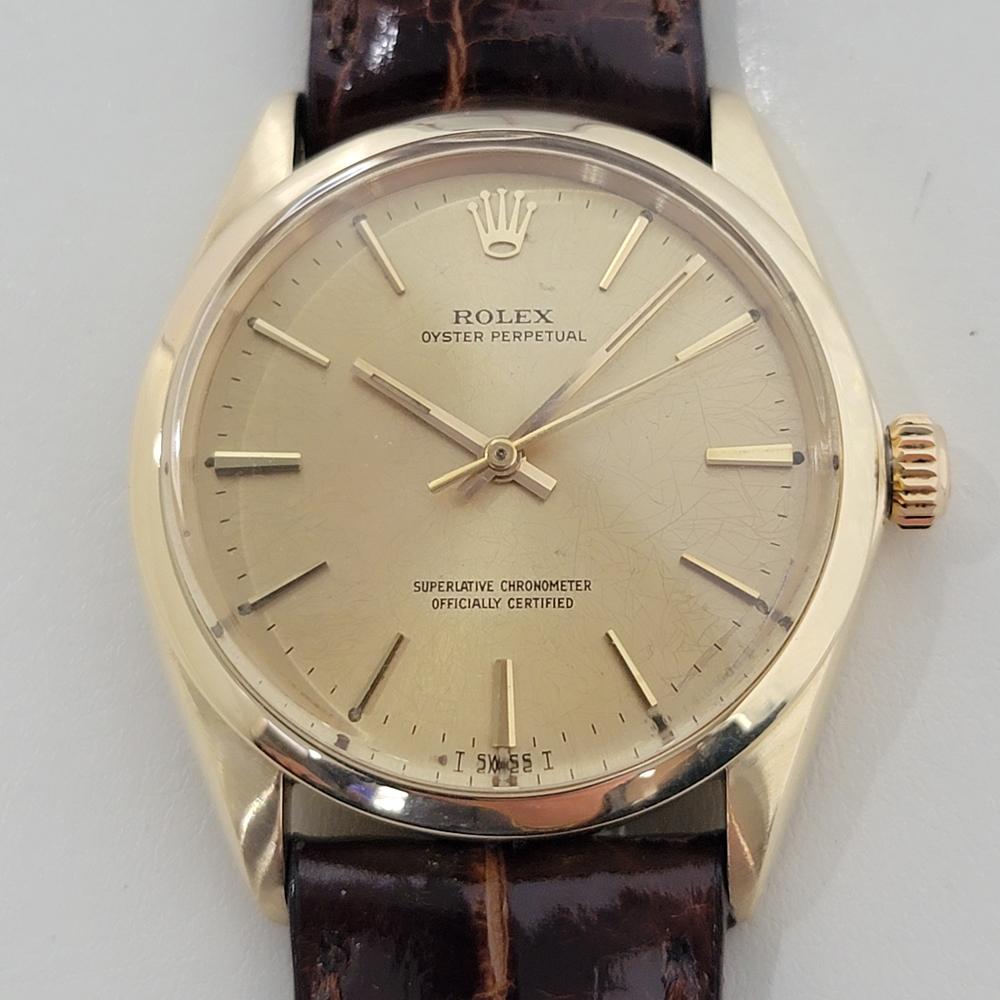 Luxurious classic, Men's 14k solid gold Rolex Oyster Perpetual ref.1002 automatic, c.1966, in excellent working condition. Verified authentic by a master watchmaker. Gorgeous, Rolex signed gold dial, with unique spider pattern, applied index baton