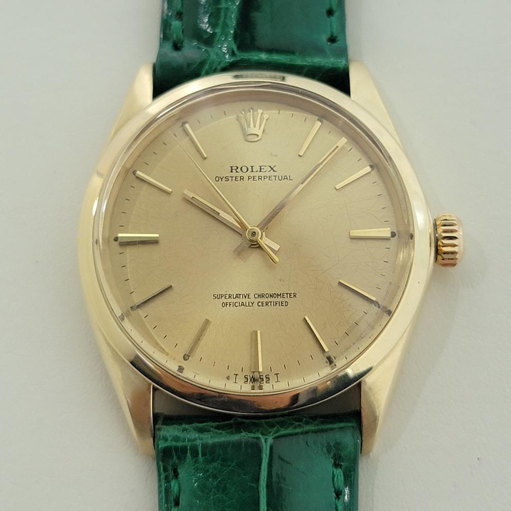 Elegant luxury, Men's 14k solid gold Rolex Oyster Perpetual ref.1002 automatic, c.1966, in excellent working condition. Verified authentic by a master watchmaker. Gorgeous, Rolex signed gold spider dial, applied index baton hour markers, gilt minute