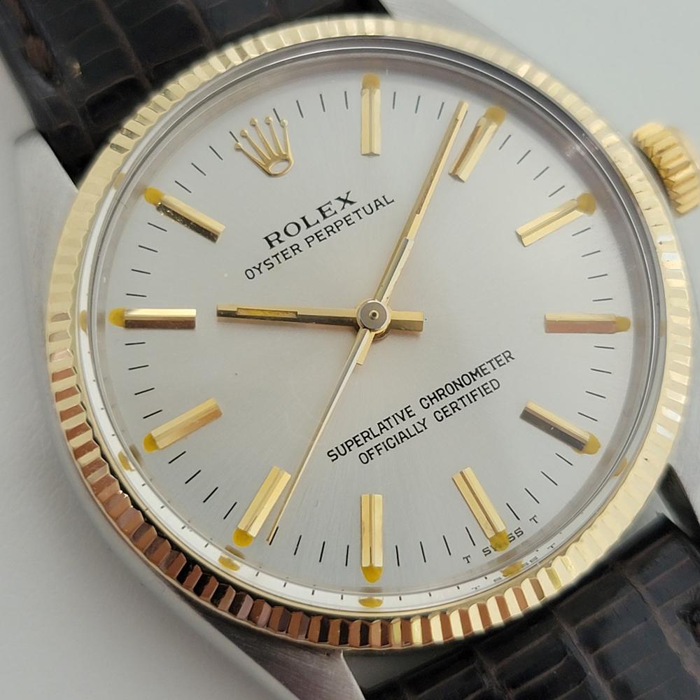 Classic icon, Men's 14K gold & stainless steel Rolex Oyster Perpetual Ref.1005 automatic, c.1979, with original Rolex paper. Verified authentic by a master watchmaker. Gorgeous Rolex signed silver dial, applied gold baton hour markers, gilt minute