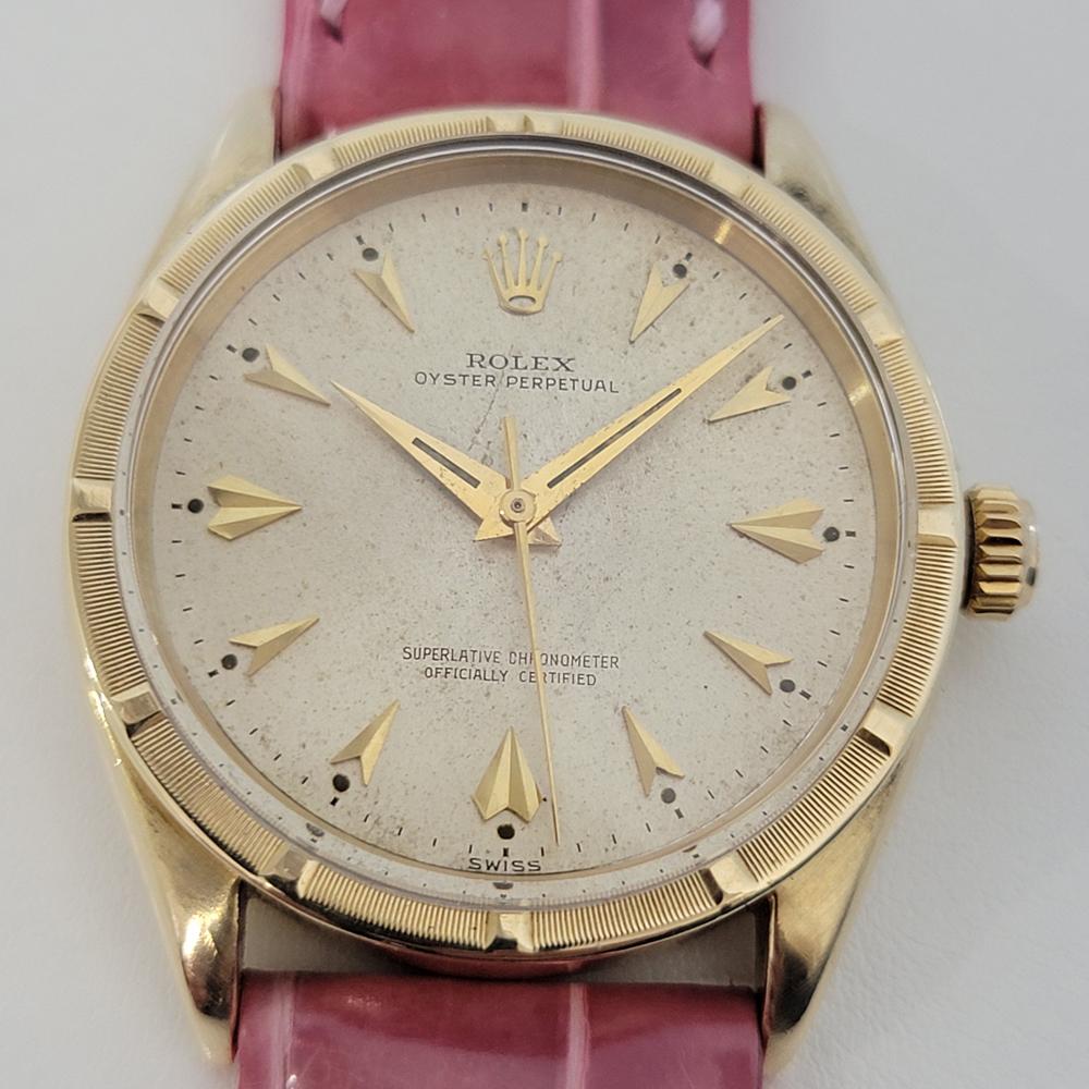 Timeless classic, Men's 14k solid gold Rolex Ref.1007 Oyster perpetual automatic dress watch, c.1960s. Verified authentic by a master watchmaker. Gorgeous, unrefurbished Rolex signed dial, applied arrowhead hour markers, gilt minute and hour hands,