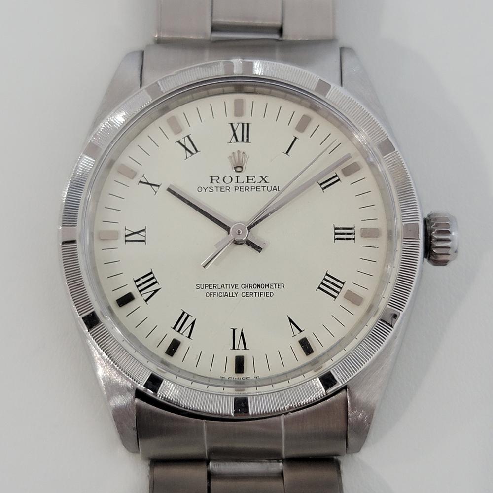 Timeless classic, Men's all-stainless steel Rolex Ref.1007 Oyster perpetual automatic dress watch, c.1965. Verified authentic by a master watchmaker. Gorgeous Rolex signed silver dial, applied indice and black Roman numeral hour markers, silver