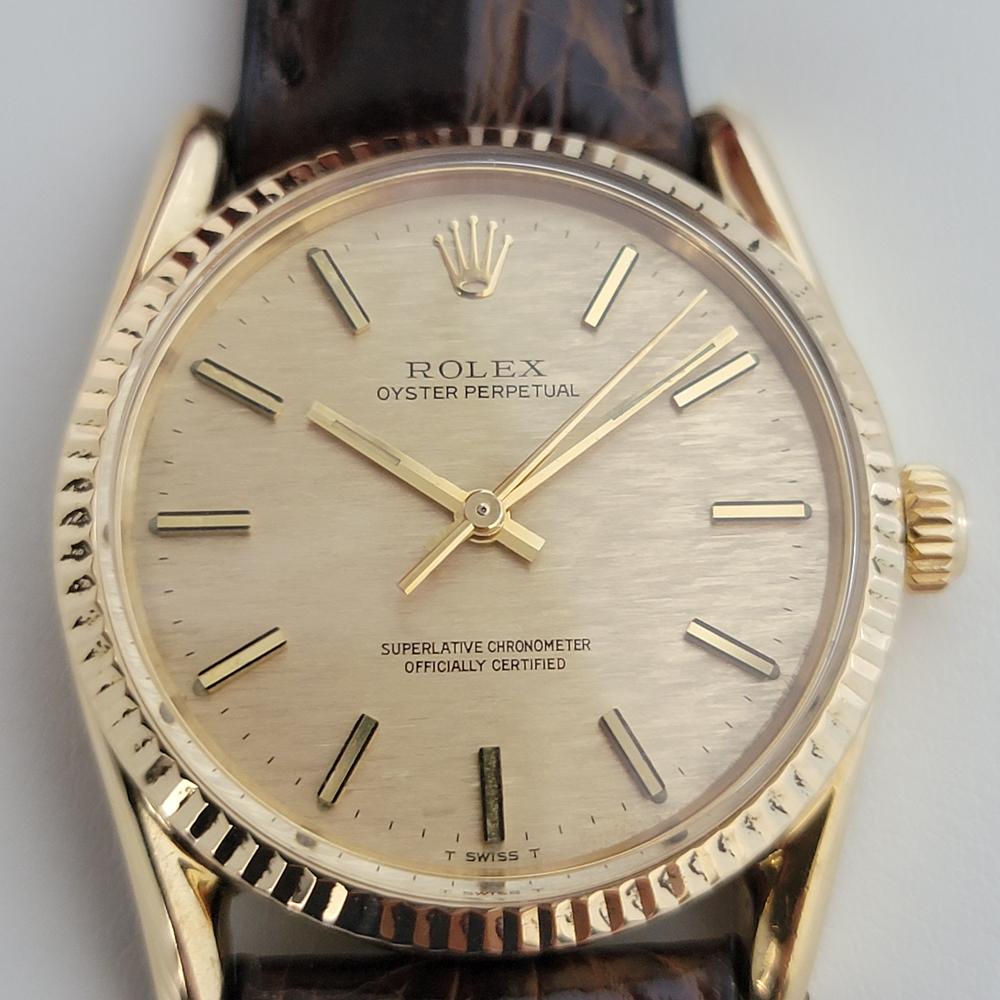 Luxurious classic, Men's 18K solid gold Rolex Oyster Perpetual Ref.1011 automatic, c.1970s. Verified authentic by a master watchmaker. Gorgeous Rolex signed gold textured dial, applied gold baton hour markers, gilt minute and hour hands, sweeping