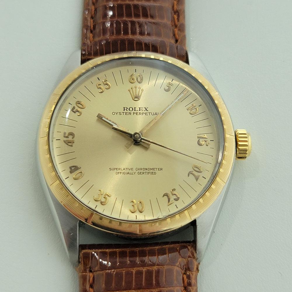 A rare vintage classic, Men's Rolex Oyster Perpetual ref.1038 18k gold & stainless steel automatic with unique race dial, c.1987. Verified authentic by a master watchmaker. Gorgeous rare Rolex signed gold race dial, no-hour markers, applied Arabic