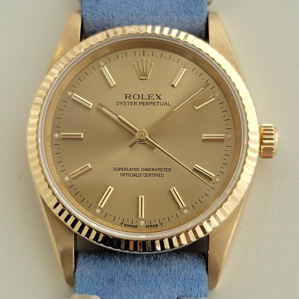 Rare luxurious classic, Men's 18k solid gold Rolex Oyster Perpetual Ref.14238 automatic, c.1991, in excellent working condition. Verified authentic by a master watchmaker. Gorgeous Rolex signed gold dial, applied baton indice hour markers, gilt