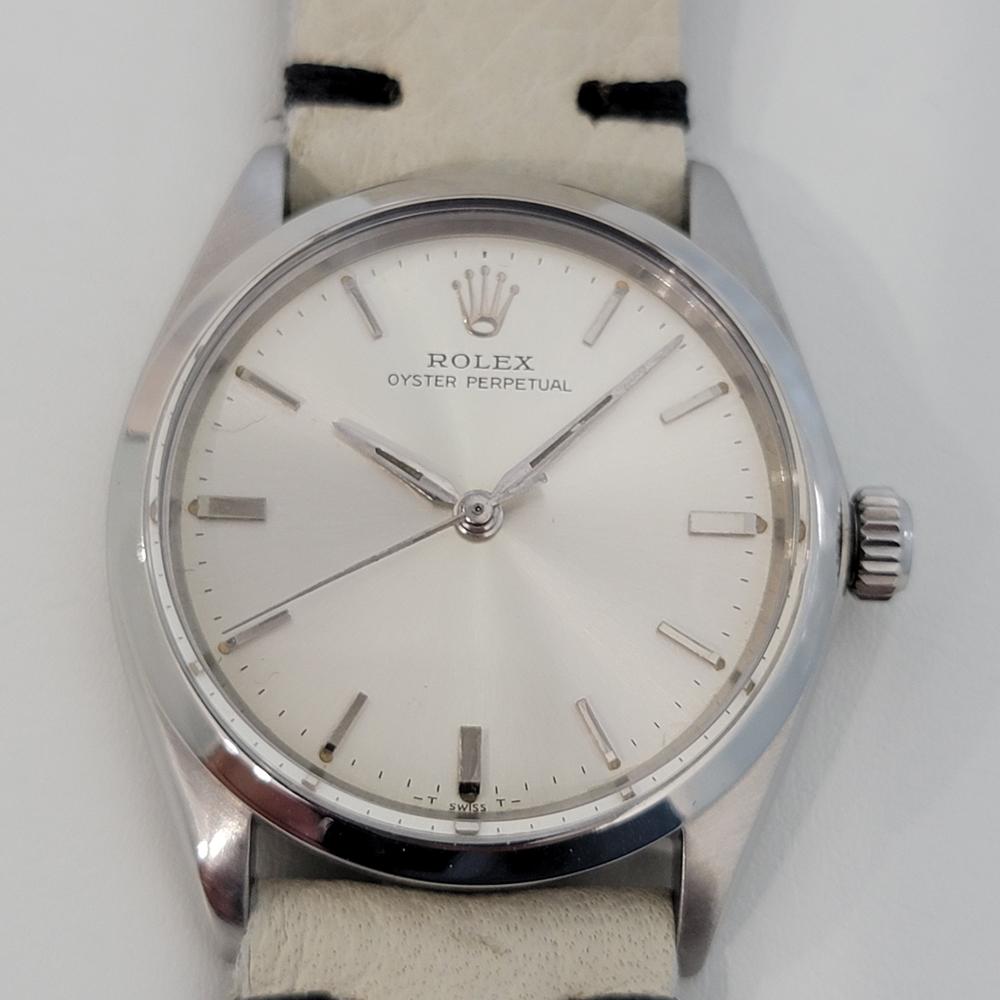 Iconic classic, Men's Rolex 5552 Oyster Perpetual automatic dress watch, c.1965. Verified authentic by a master watchmaker. Gorgeous Rolex signed silver dial, applied indice hour markers, minute and hour hands, sweeping central second hand, hands