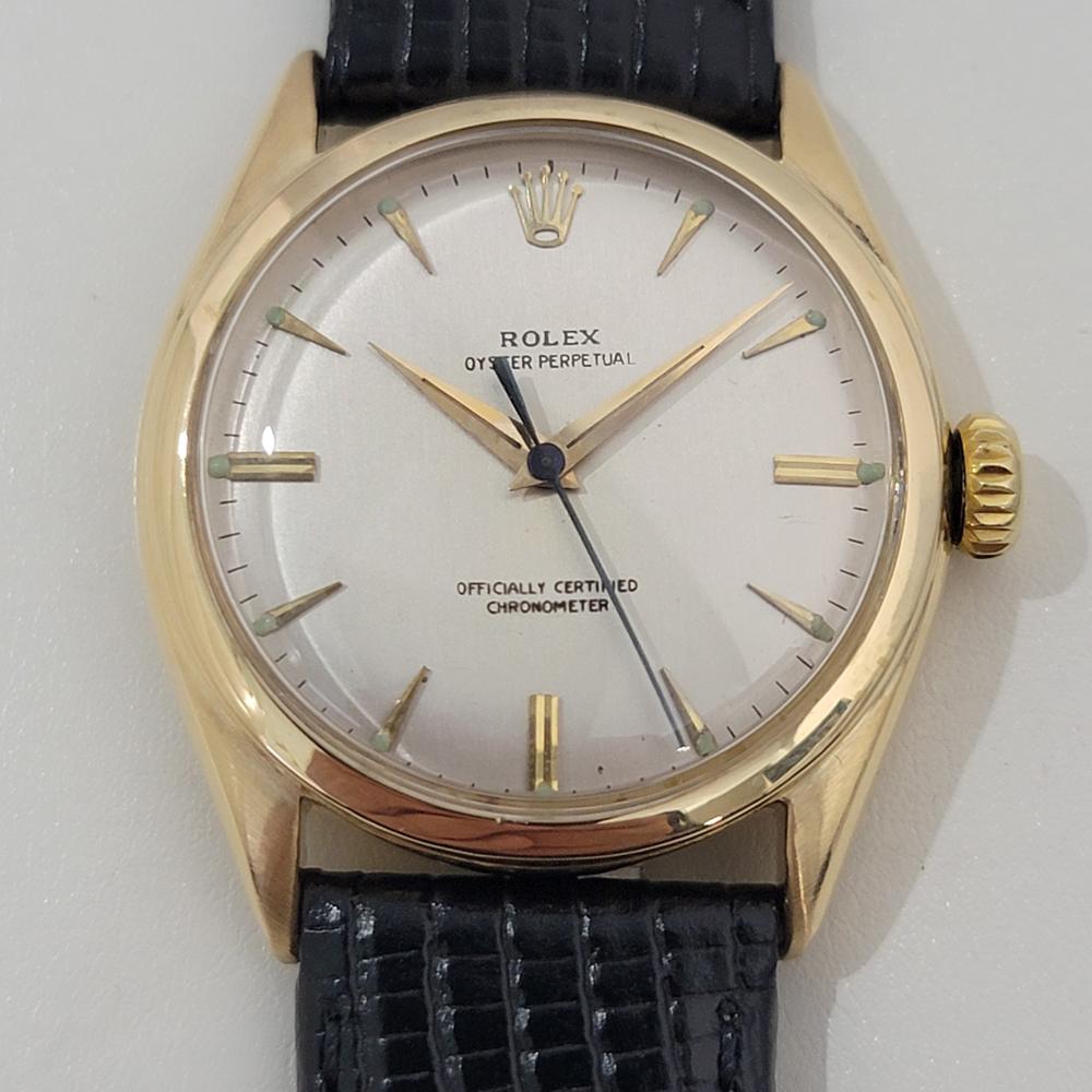 Luxurious classic, Men's 18k solid gold Rolex Oyster Perpetual Ref.6084 semi bubbleback automatic dress watch, c.1954, in excellent working condition. Verified authentic by a master watchmaker. Gorgeous, Rolex signed dial, applied gold dagger index