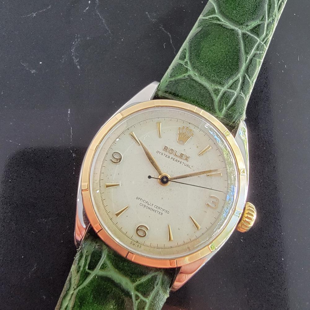 Classic icon, Men's 14k gold & ss Rolex Oyster perpetual automatic dress watch, c.1952. Verified authentic by a master watchmaker. Gorgeous Rolex signed dial, applied index and Arabic 3, 6, 9 numeral hour markers, gilt minute and hour hands,