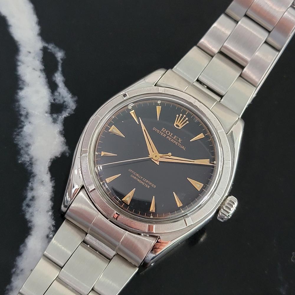 Vintage icon, Men's all-stainless steel Rolex ref.6085 Oyster Perpetual automatic dress watch, c.1955, all original. Verified authentic by a master watchmaker. Gorgeous Rolex signed black dial, applied rose gold arrowhead hour markers, gilt minute