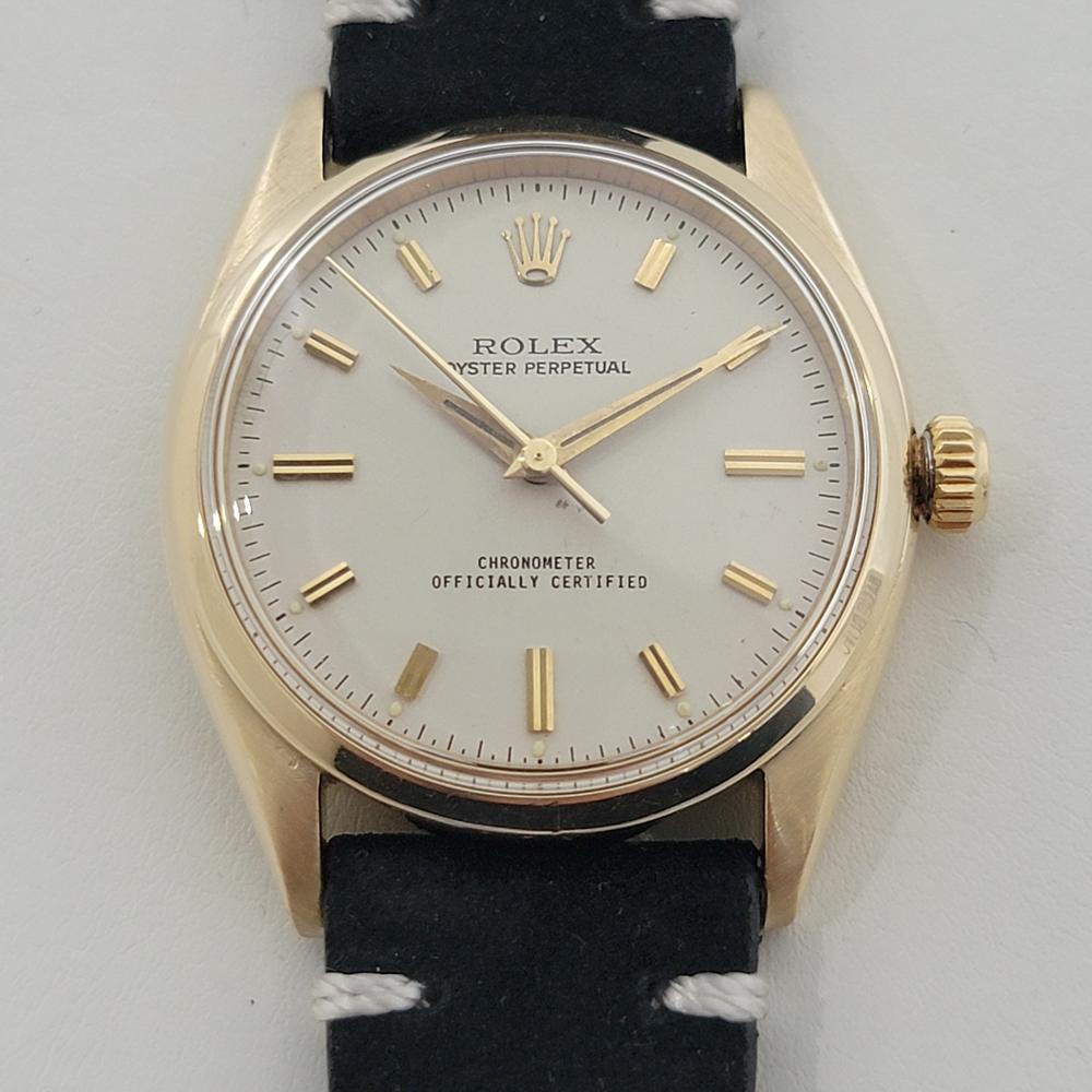 Timeless luxury, Men's 14k solid gold Rolex Oyster Perpetual Ref.6564 automatic dress watch, c.1950s, in excellent working condition. Verified authentic by a master watchmaker. Gorgeous Rolex signed dial, applied double baton index hour markers,