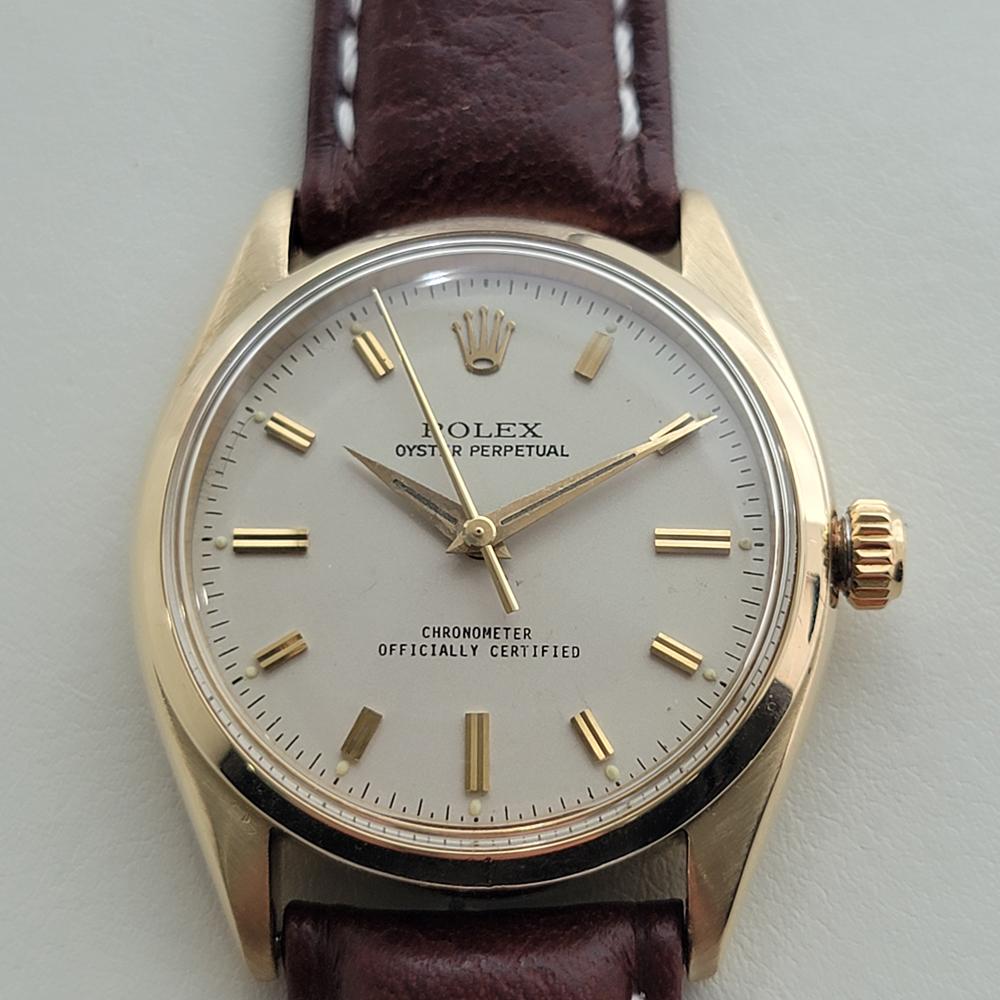 Classic luxury, Men's 14k solid gold Rolex Oyster Perpetual Ref.6564 automatic dress watch, c.1950s, in excellent working condition. Verified authentic by a master watchmaker. Gorgeous Rolex signed dial, applied double baton index hour markers, gilt