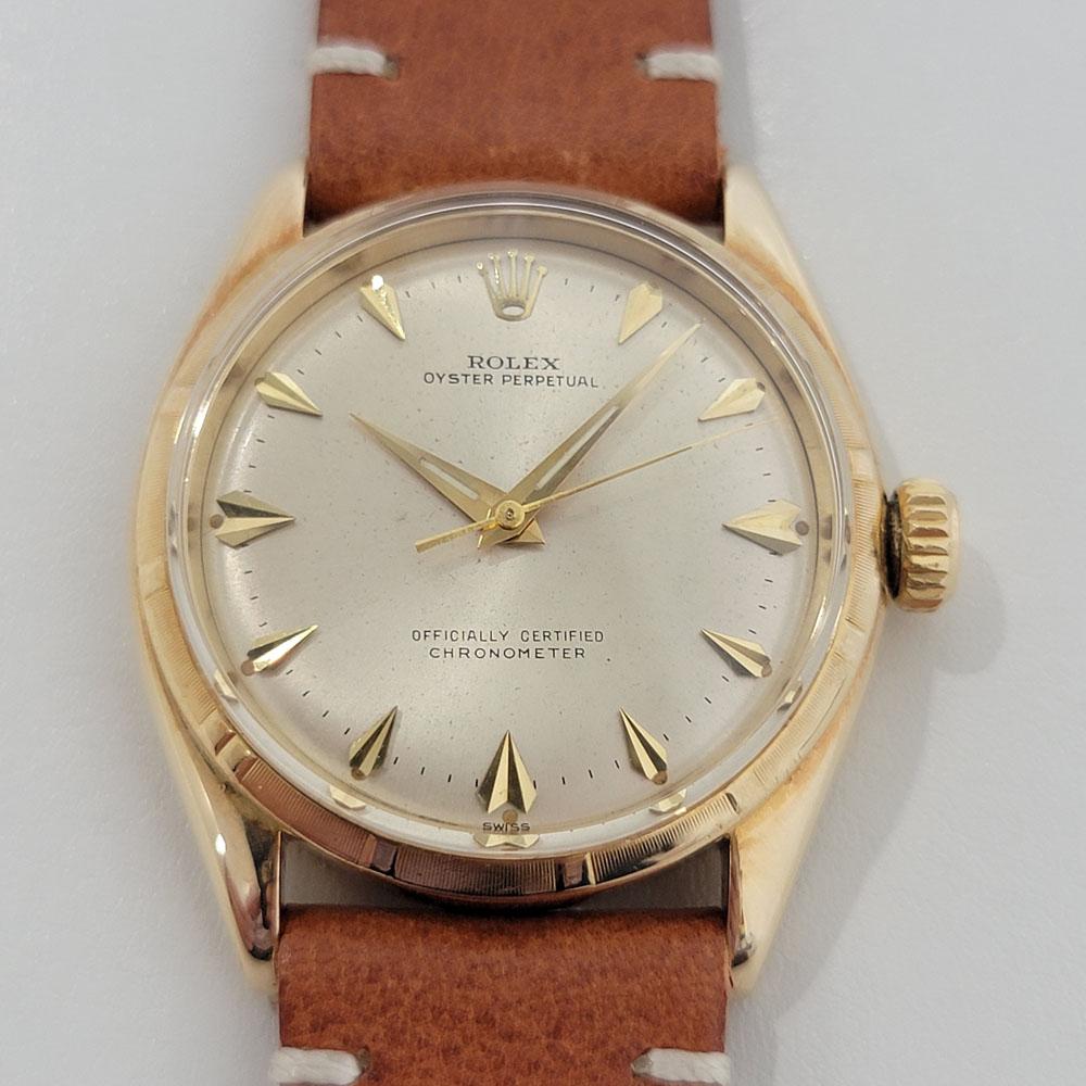 Iconic classic, Men's 14k solid gold Rolex Oyster Perpetual 6585 automatic, c.1960s. Verified authentic by a master watchmaker. Gorgeous, original, unrestored Rolex signed gold dial, applied uniquely designed hour markers, gilt minute and hour