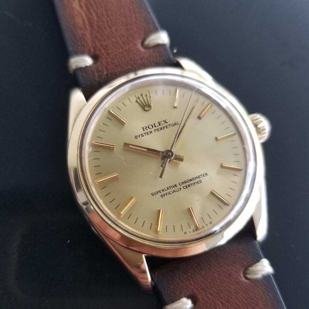 Luxurious icon, men's 14k solid gold Rolex's Ref.1002 Oyster Perpetual automatic, c.1976. Verified authentic by a master watchmaker. Gorgeous, Rolex signed golden dial, applied indice hour markers, gilt minute and hour hands, sweeping central second
