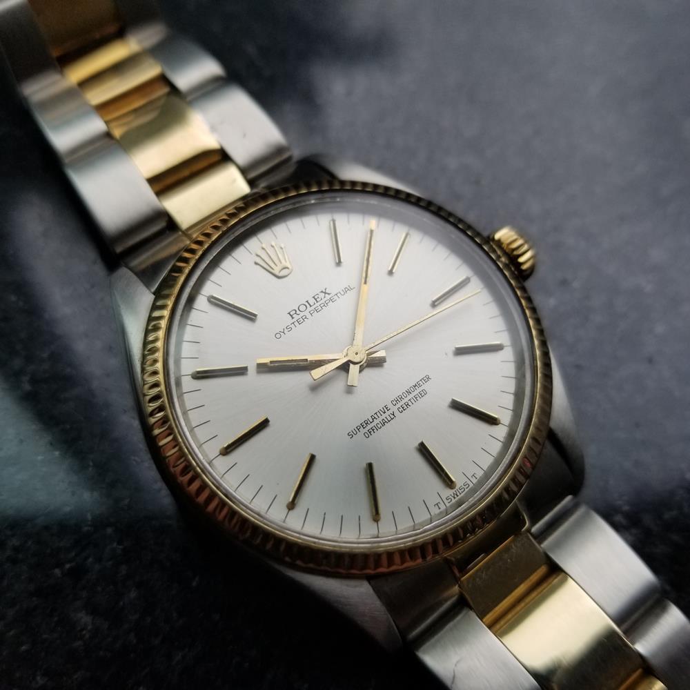 Luxurious icon, men's 18K gold & stainless steel Rolex Oyster Perpetual Ref.1005 automatic, c.1981. Verified authentic by a master watchmaker. Original Rolex signed silver dial, applied gold baton hour markers, gold minute and hour hands, sweeping