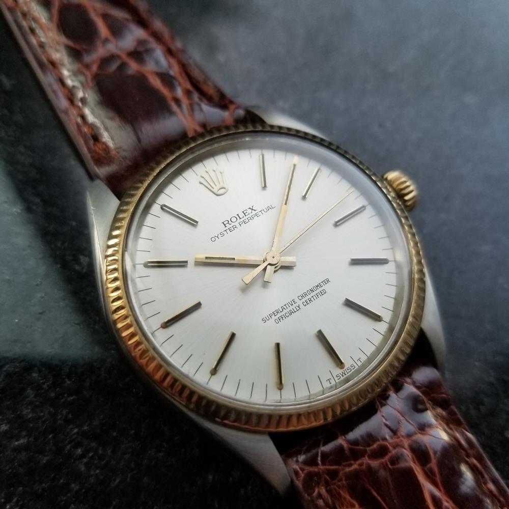 Iconic classic, men's 18K gold & stainless steel Rolex Oyster Perpetual Ref.1005 automatic, c.1981. Verified authentic by a master watchmaker. Original Rolex signed silver dial, applied gold baton hour markers, gold minute and hour hands, sweeping