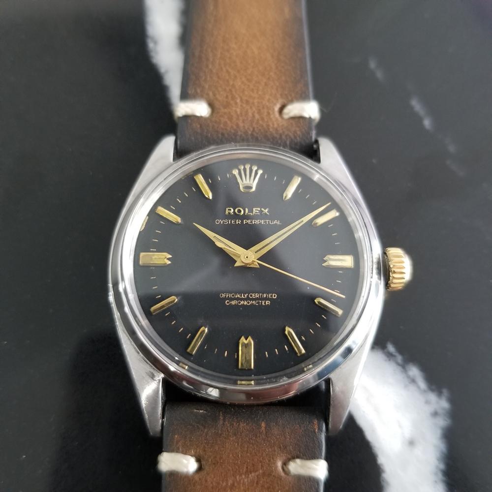 Gorgeous classic, Men's Rolex ref.6564 Oyster Perpetual automatic dress watch, c.1957. Verified authentic by a master watchmaker. Stunning Rolex signed black dial, applied gilt indice hour markers, gilt minute and hour hands, sweeping central second