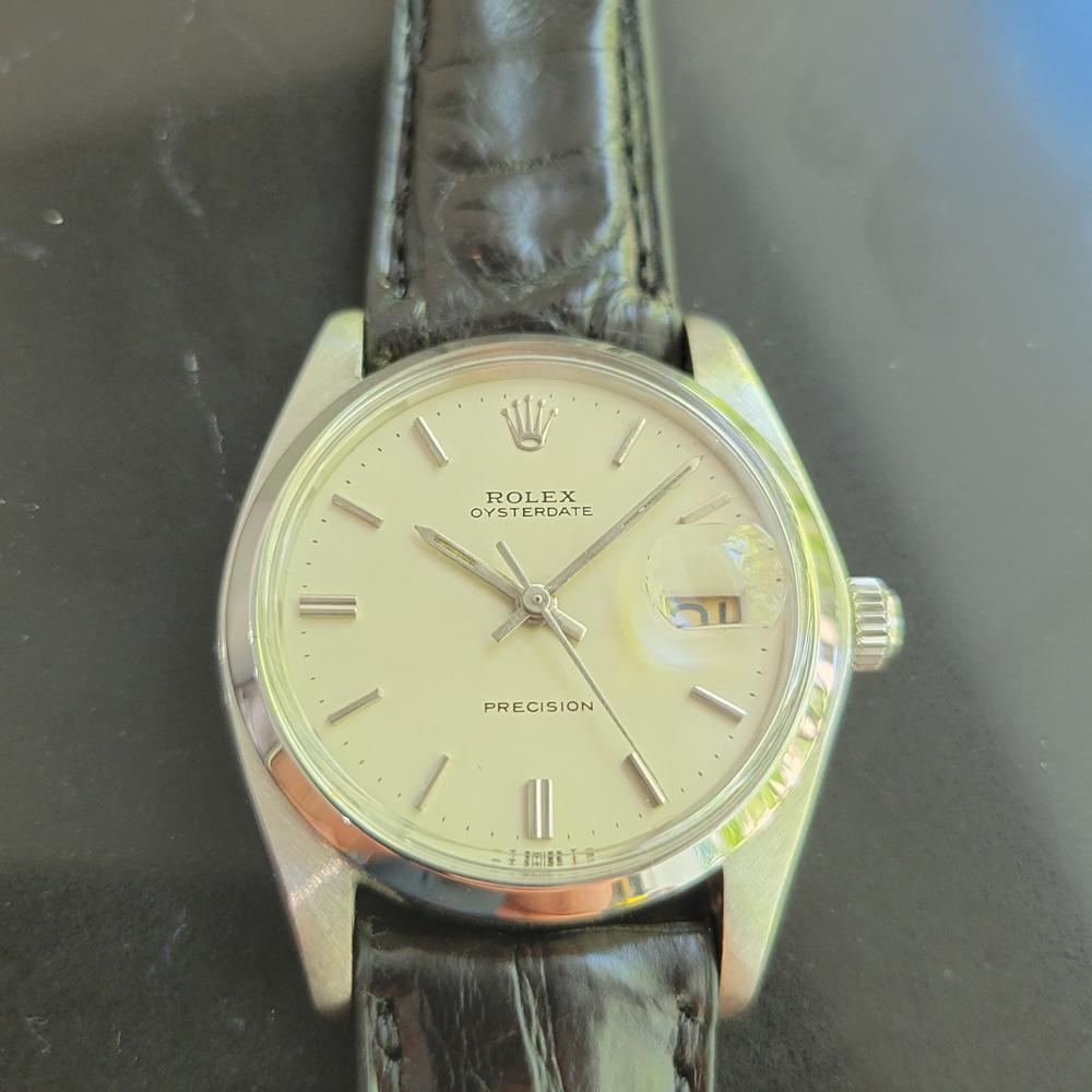 Classic icon, Men's Rolex ref.6694 Oysterdate Precision hand-wind dress watch, c.1980. Verified authentic by a master watchmaker. Gorgeous Rolex signed creamy white dial, applied indice hour markers, silver minute and hour hands, sweeping central