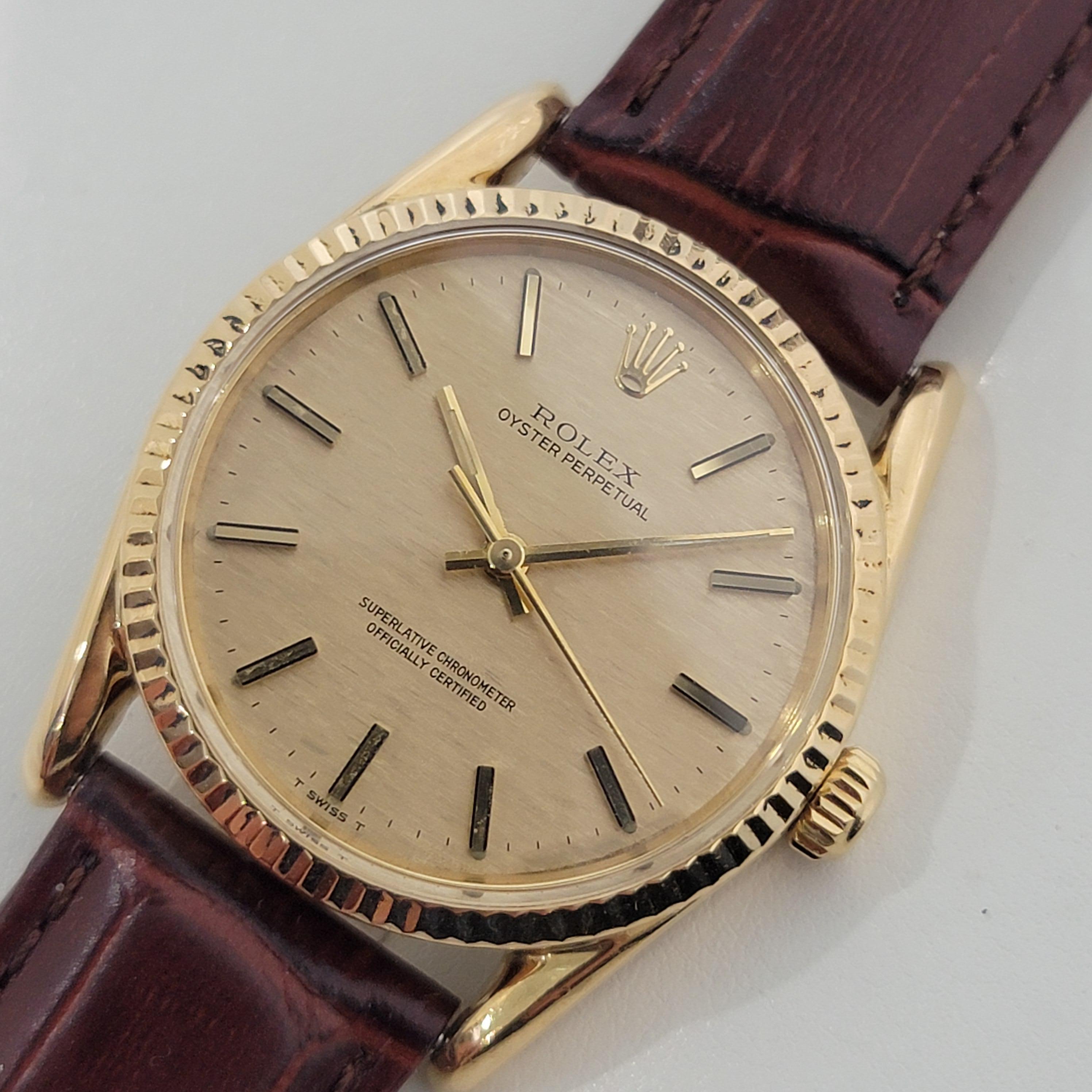 Luxurious classic, Men's 18K solid gold Rolex Oyster Perpetual Ref.1011 automatic, c.1970s. Verified authentic by a master watchmaker. Gorgeous Rolex signed gold textured dial, applied gold baton hour markers, gilt minute and hour hands, sweeping
