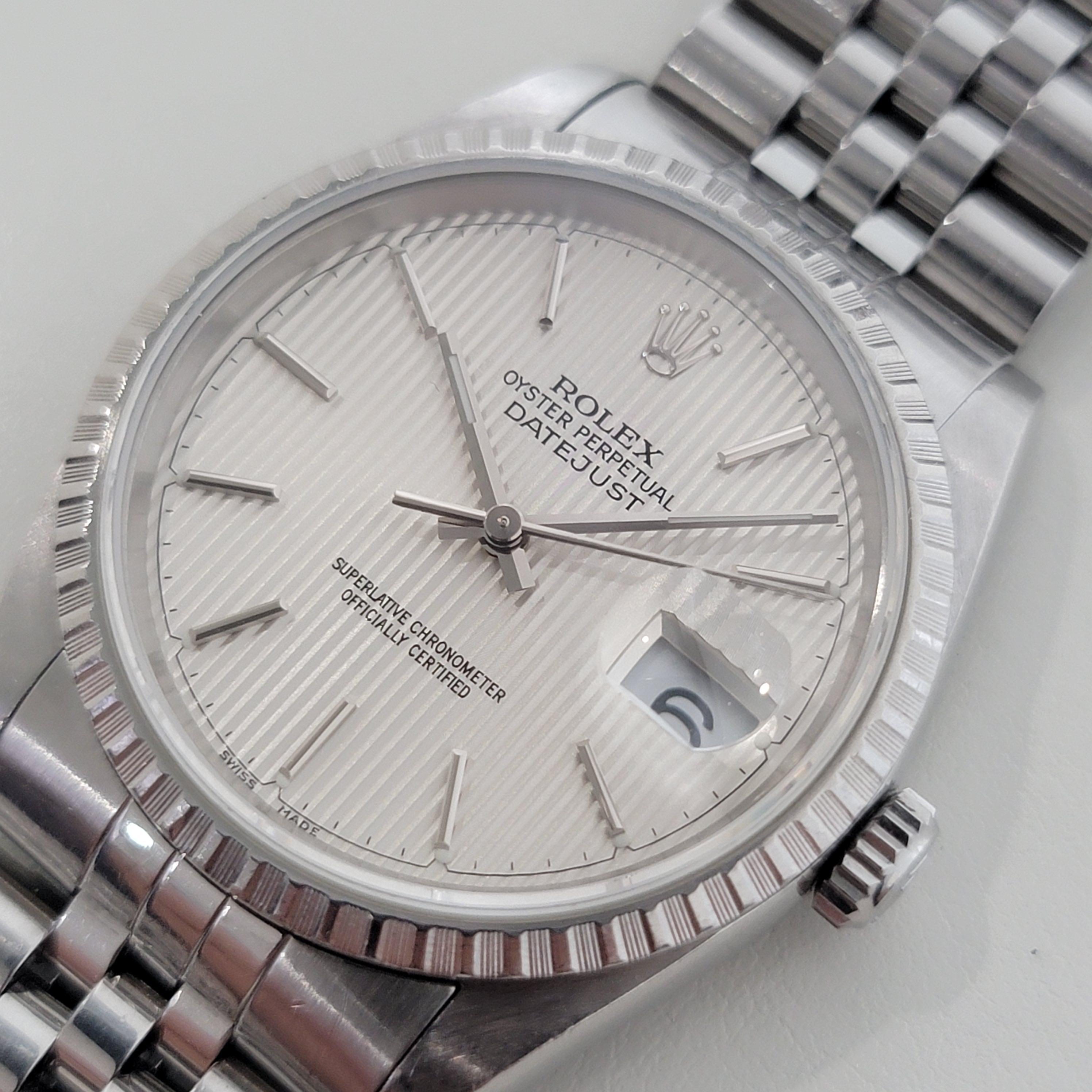 A rare, iconic classic, Men's all-stainless steel Rolex Oyster Datejust ref.16220 automatic, c.1991, all original. Verified authentic by a master watchmaker. Gorgeous, rare Rolex signed tapestry dial, applied silver baton indice hour markers, silver