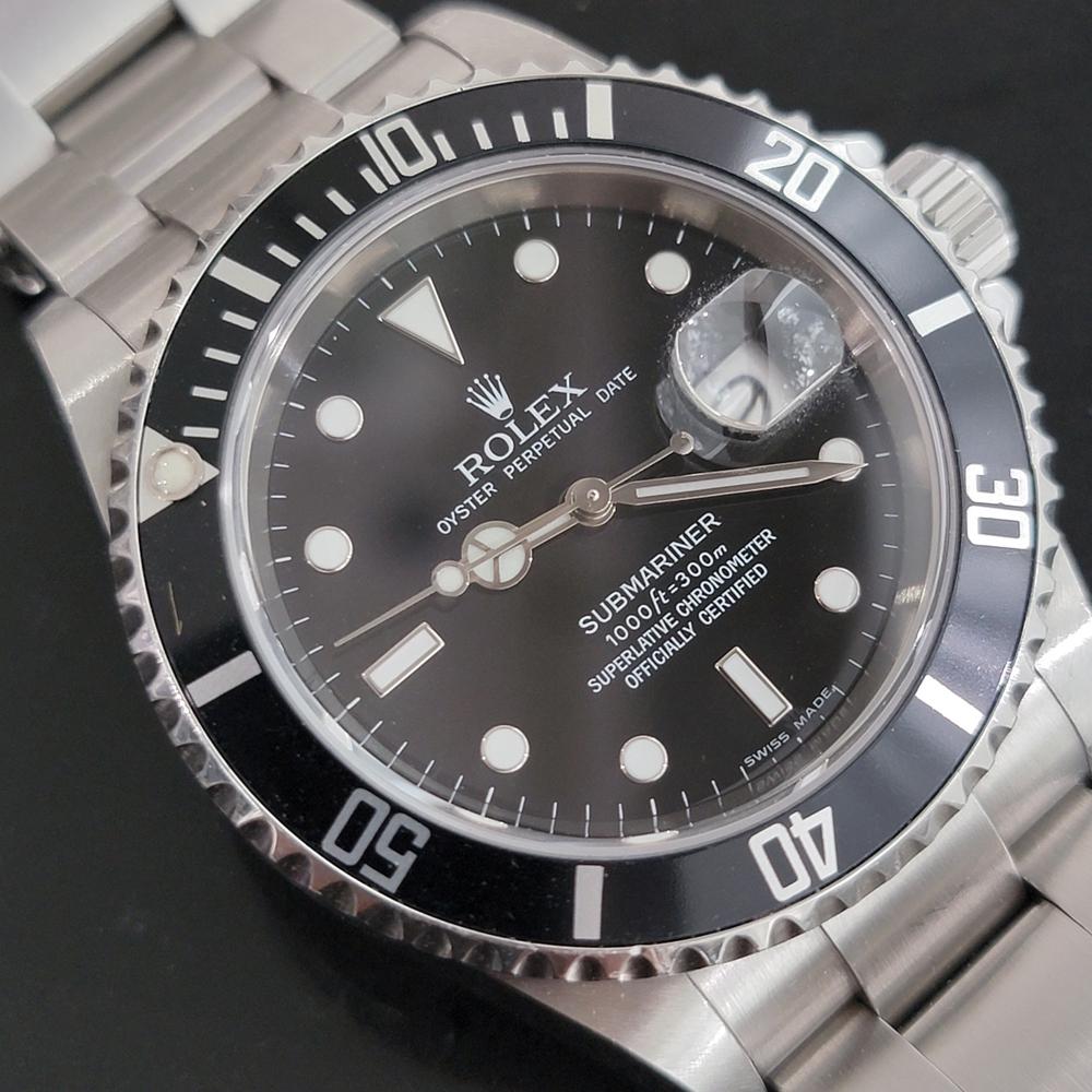 Timeless icon, Men's all-stainless steel Rolex Oyster Perpetual Date Submariner ref.16610 automatic, c.2008, all original, with Rolex pouch. Verified authentic by a master watchmaker. Gorgeous Rolex signed black dial, applied lumed droplet hour