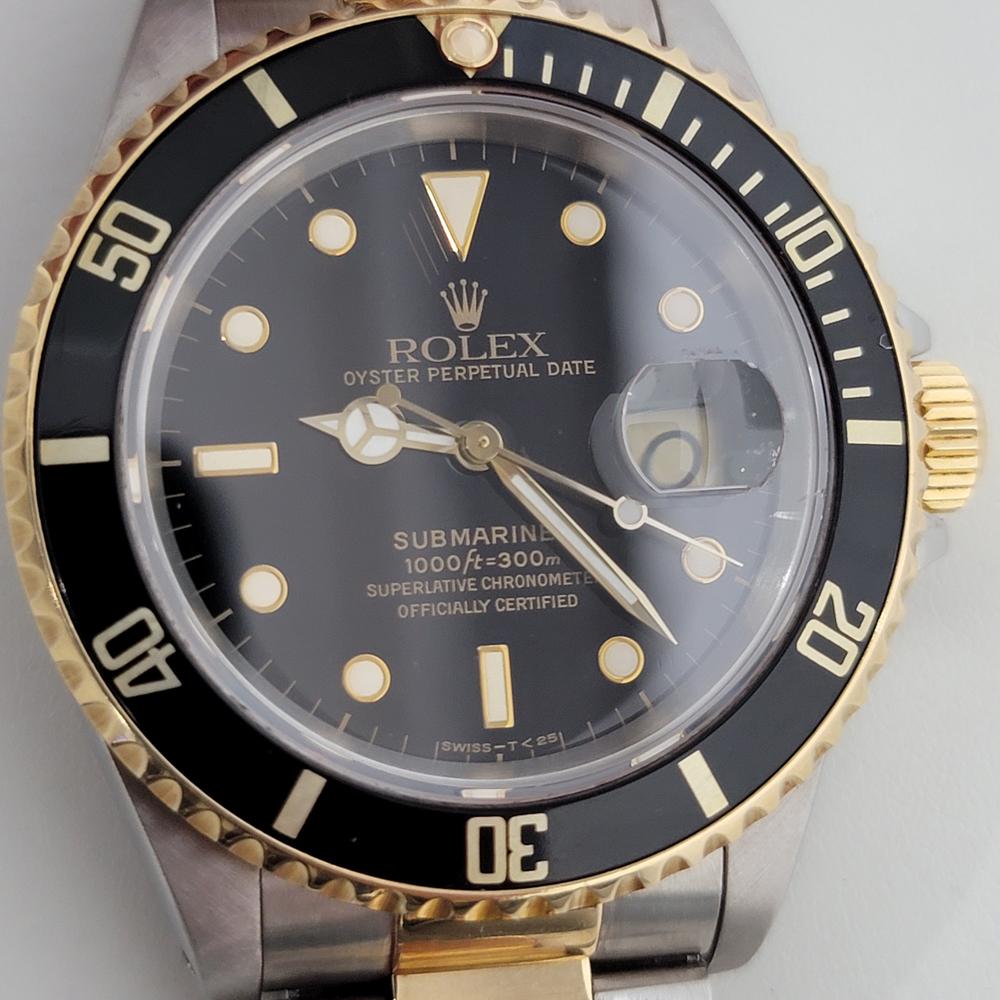 Iconic luxury, Men's 18k gold & stainless steel Rolex Oyster Perpetual Date 16613 Submariner automatic, c.1989, all original, with Rolex pouch. Verified authentic by a master watchmaker. Gorgeous Rolex signed black dial, applied lumed hour markers,