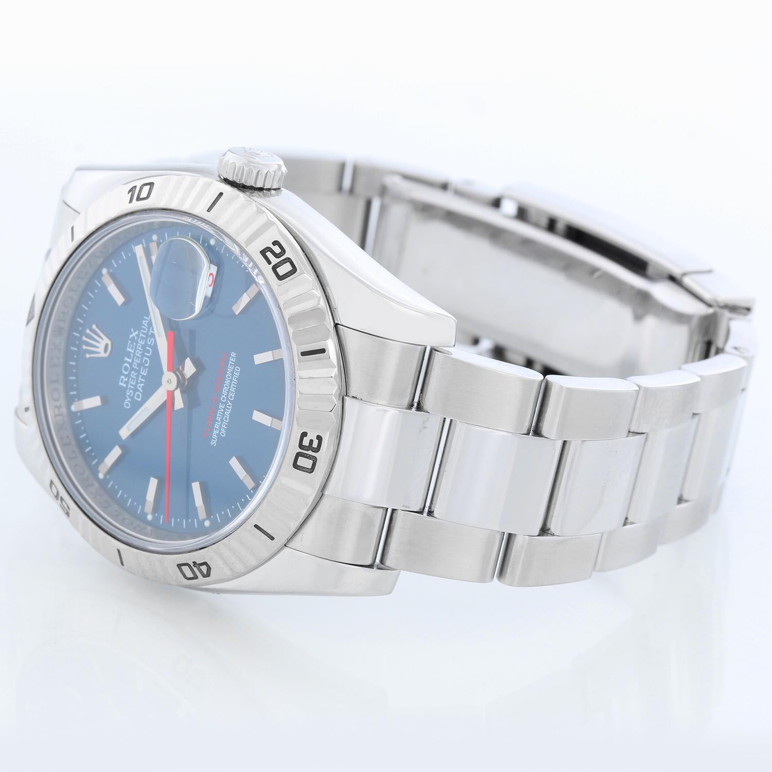 Men's Rolex Turnograph Datejust Stainless Steel Watch 116264 - Automatic winding, 31 jewel, sapphire crystal. Stainless steel case with 18k white gold Thunderbird bezel  (36mm diameter). Blue dial with stick markers; red date and second hand.