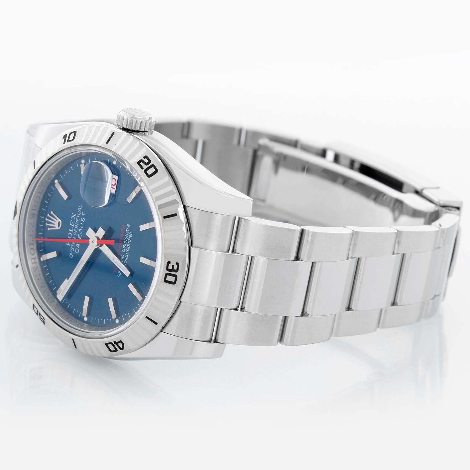 Men's Rolex Turnograph Datejust Stainless Steel Watch 116264 - Automatic winding, 31 jewel, sapphire crystal. Stainless steel case with 18k white gold Thunderbird bezel  (36mm diameter). Blue dial with stick markers; red date and second hand.