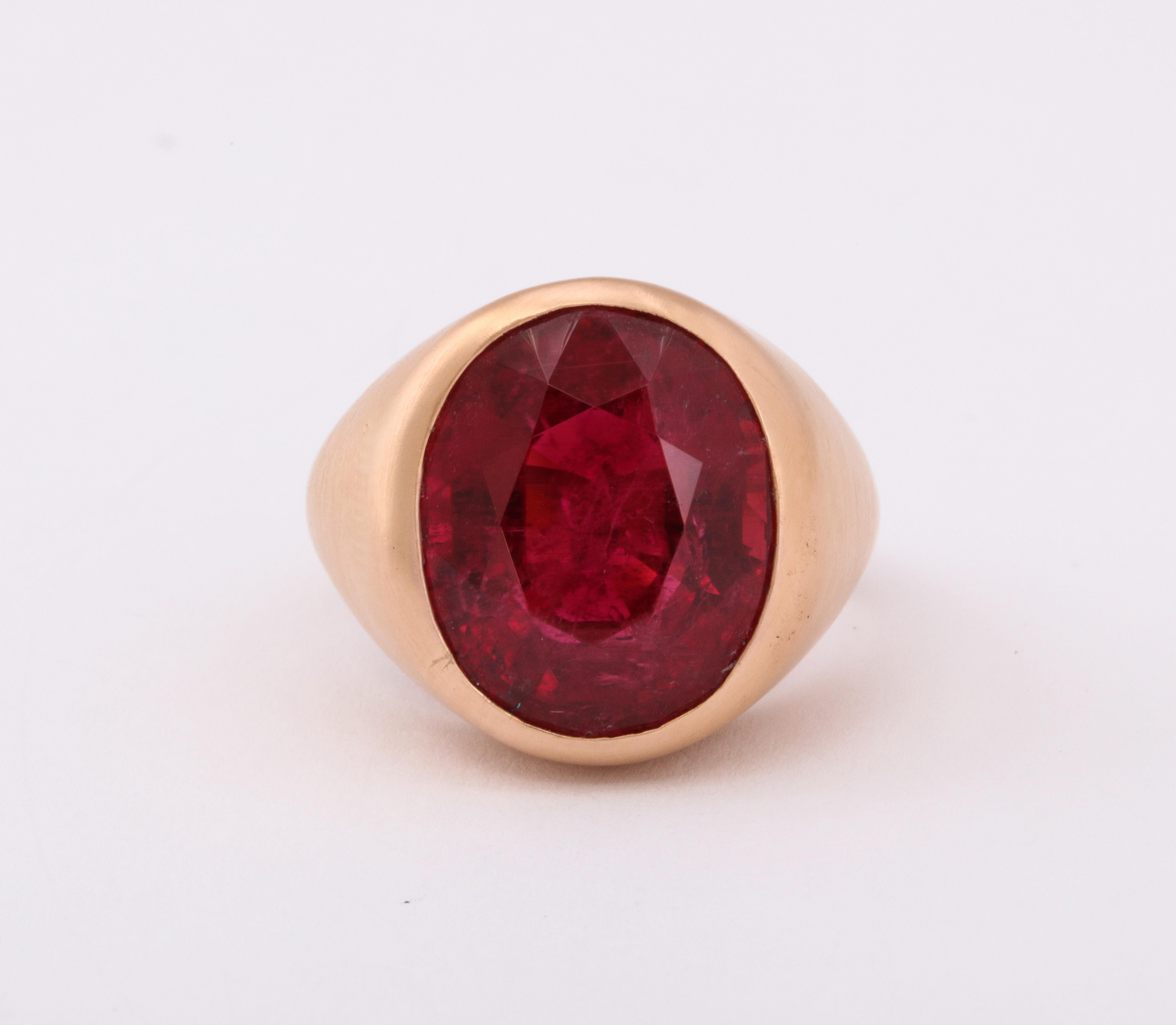  Men's Rubellite Solitaire Ring set in 18K Rose Gold 
Rubellite Weight: 17.64 Cts 
Ring Size: 9
Re- sizable free of charge 