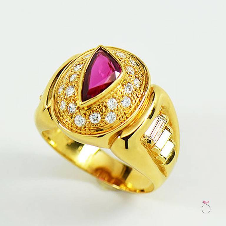 Stunning Men's Ruby & Diamond ring in 18k yellow gold. The beautiful cut triangle cut natural Ruby gorgeous bright red color, that contrasts gracefully with the rich 18k yellow gold and diamonds. The Ruby in the center is bezel set and surrounded by