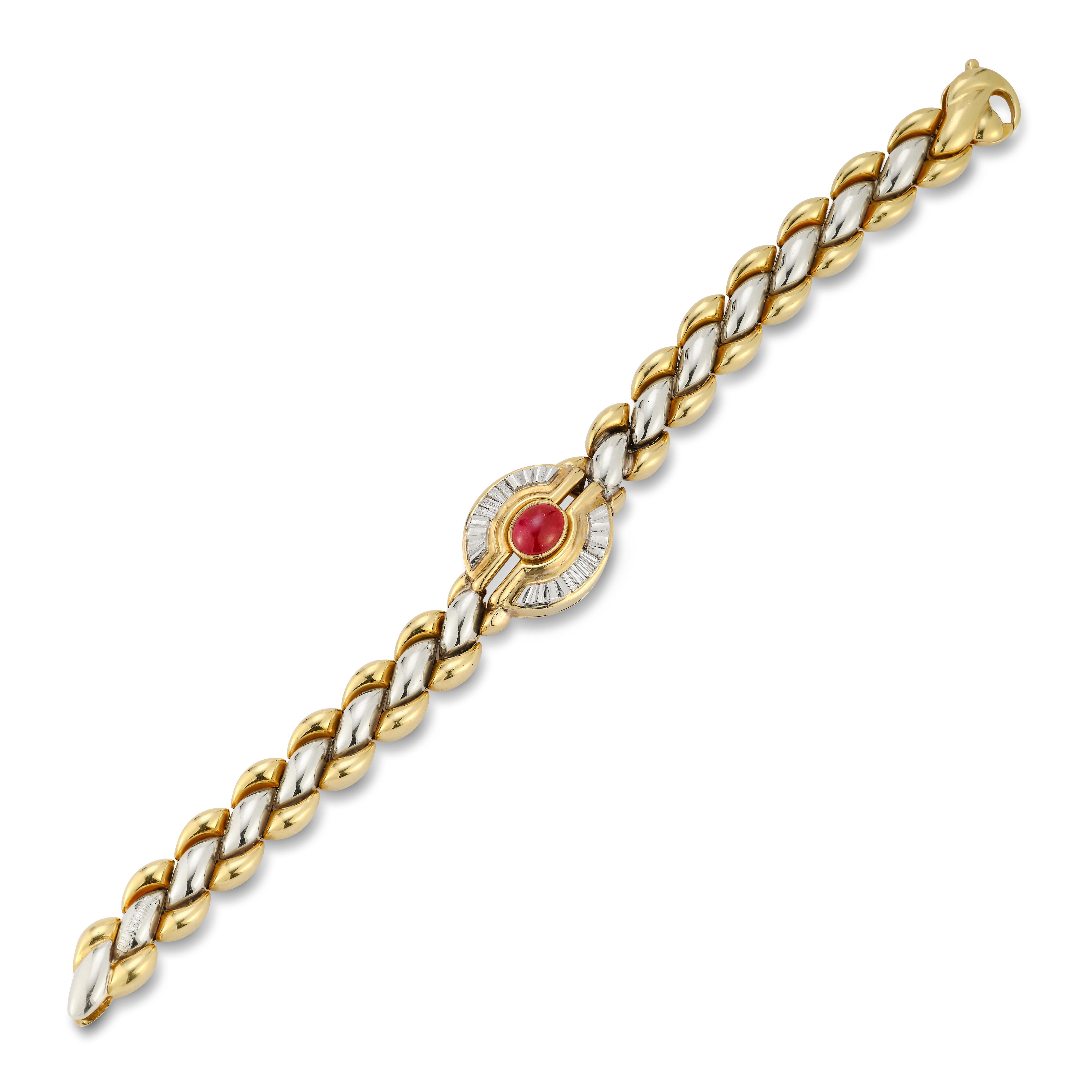 18 karat yellow and white gold bracelet with 1 cabochon ruby on the center approx 2.20 carat, 8 baguettes diamonds approx .054 carat

18 karat yellow gold
7.5 inches long 

40.6 Grams