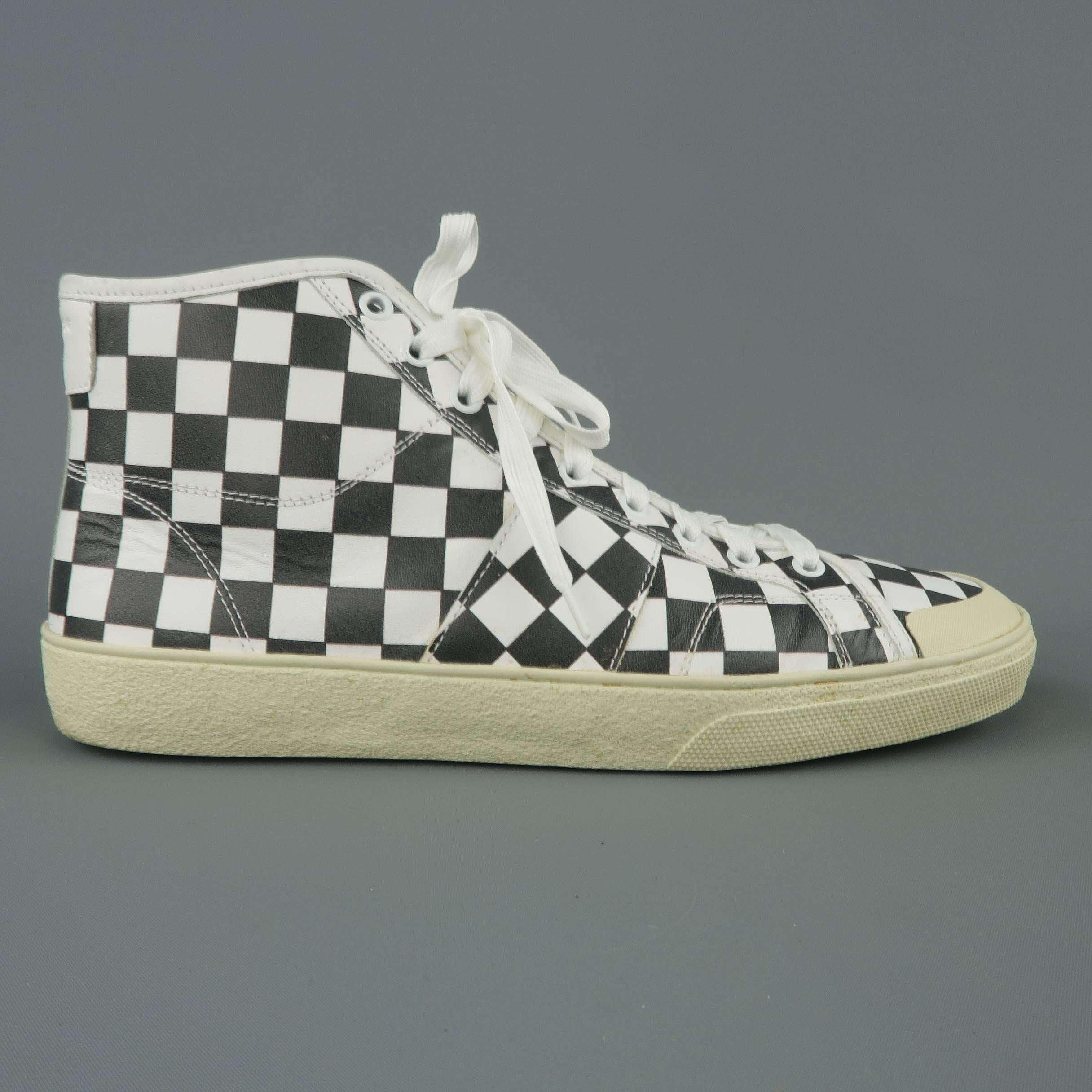 SAINT LAURENT SL/37M high top sneakers come in black and white checkered print leather with a beige rubber sole and white and metallic gold laces. With box. Made in Spain.
 
Excellent Pre-Owned Condition.
Marked: IT 43
 
Outsole: 11.5 x 4 in.
