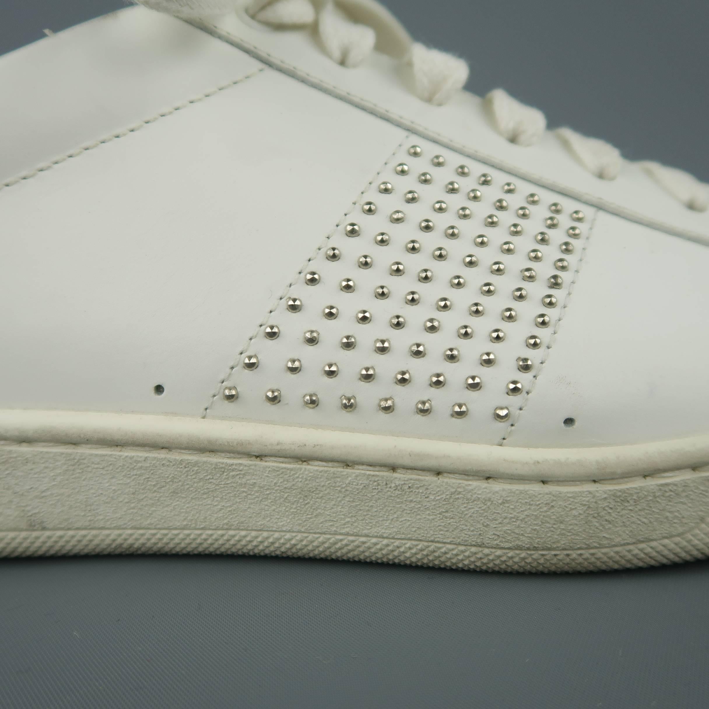 SAINT LAURENT SL/01 low top sneakers come in white leather with a studded side panel and embossed back. Wear throughout. As-is. Made in Italy.
 
Fair Pre-Owned Condition.
Marked: IT 43
 
Outsole: 11.5 x 4 in.
