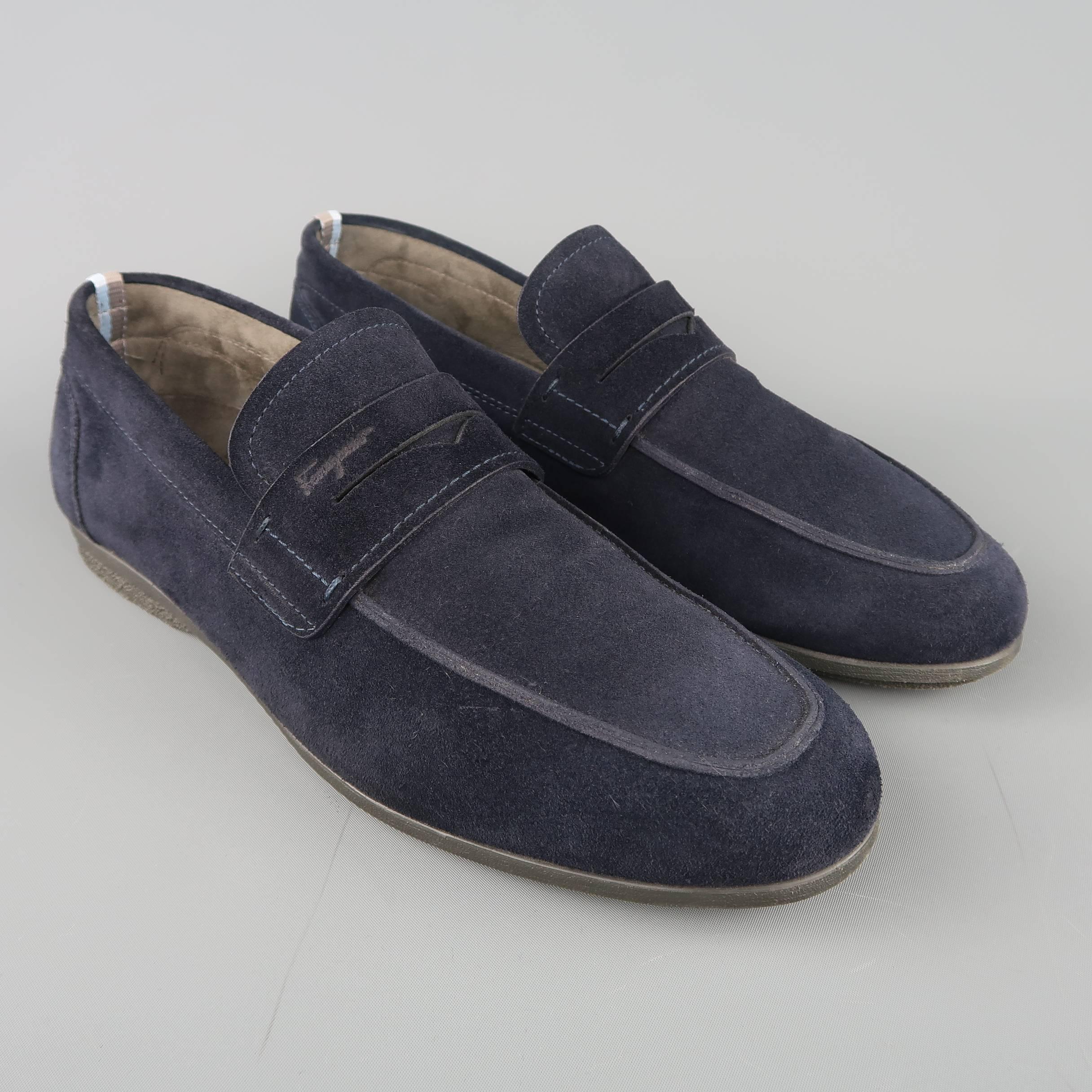 SALVATORE FERRAGAMO penny loafer comes in navy suede with an apron toe, striped ribbon detail, and rubber sole. Made in Italy.
 
Excellent Pre-Owned Condition.
Marked: UK 9.5
 
Outsole: 11.5 x 3.75 in.
