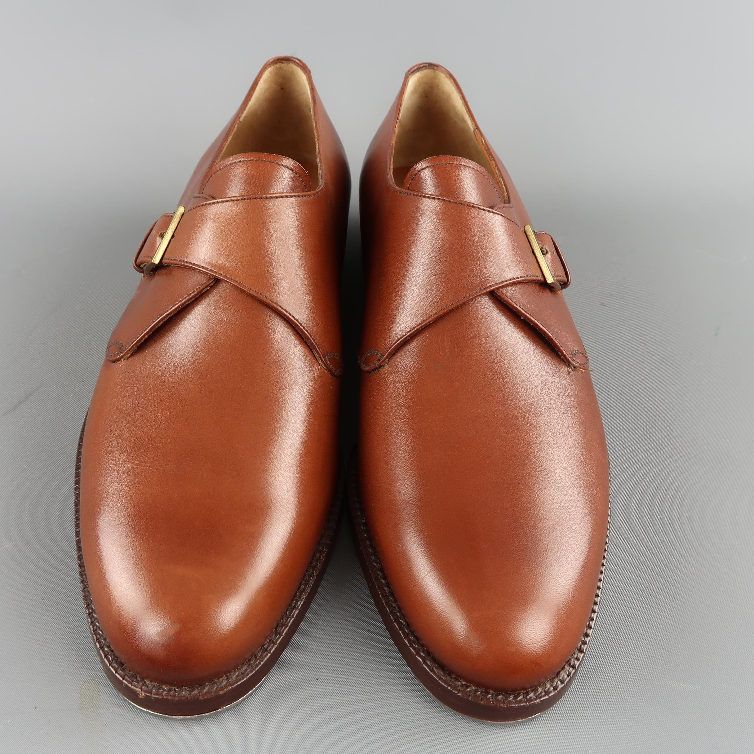 SALVATORE FERAGAMMO dress shoes come in tan leather with a single monk strap with gold tone buckle. Made in Italy.
 
Brand New.
Marked: 8.5
 
Outsole: 11.5 x 4 in.