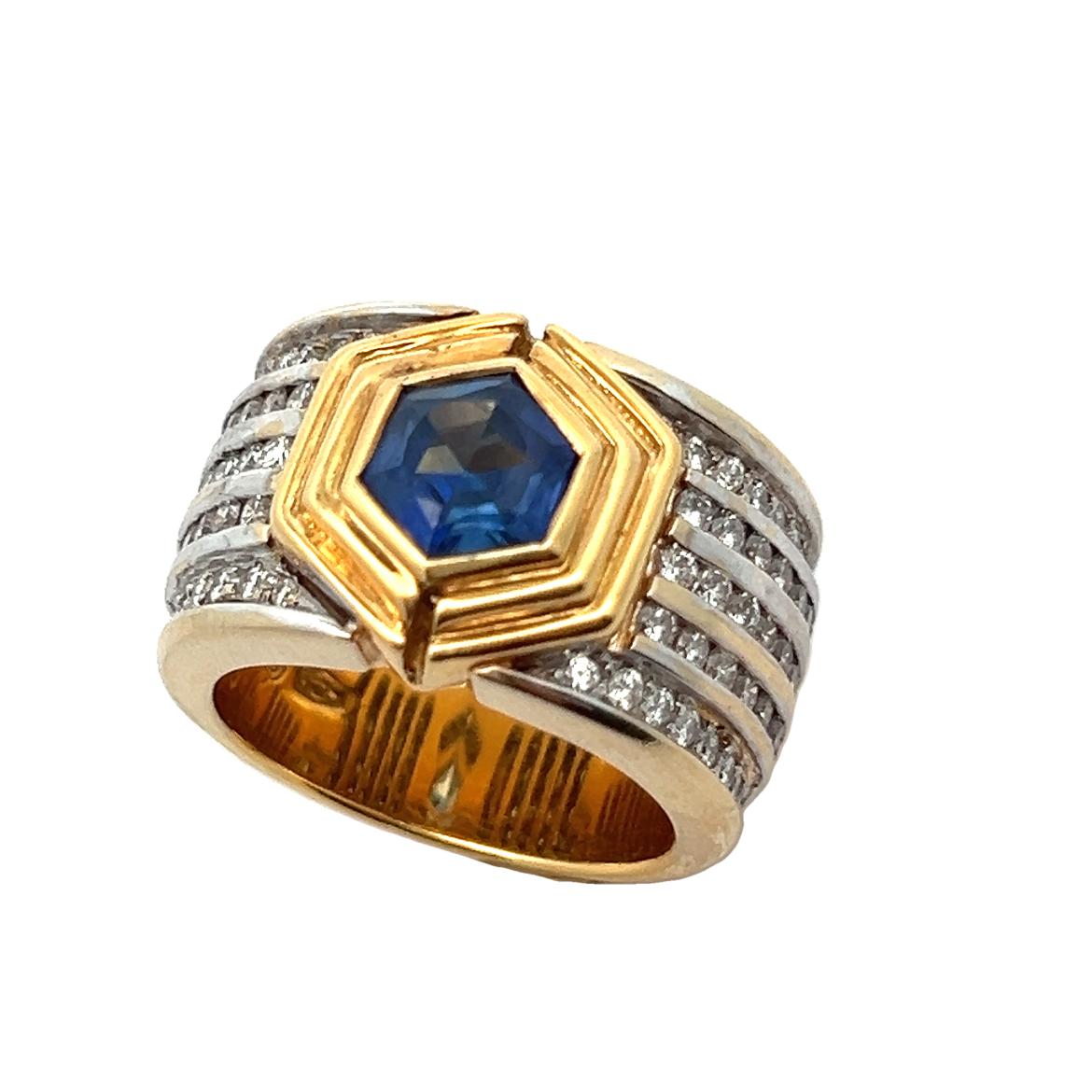 Men's Sapphire & Diamond Ring Band. 

A band consisting of a center hexagon cut sapphire with five rows of round cut diamonds. 

Sapphire Weight: approximately 1.00 carats 

Diamond Weight: approximately 1.68 carats 

Ring Size: 8

Metal Type: 14
